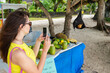 © Branislava Zivic Zrnic/Stocksy - A female taking a photo of a fruit bat.