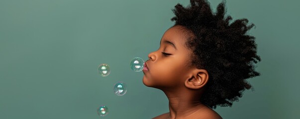 Baby giggles while blowing bubbles against a serene pastel blue backdrop