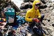 © Christine La/Stocksy - Rock climber sitting with their gear