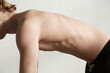 © Danil Nevsky/Stocksy - Slim shirtless body of male yogi practicing yoga in fitness center