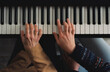 © Milles Studio/Stocksy - Mother and daughter playing piano together