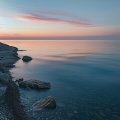 Poster - The ocean is calm and the sky is a beautiful pink color