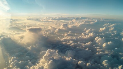 Wall Mural - the view from a plane window with pyrocumulus clouds stretching out as far as the eye can see.