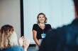 © Jacob Lund - Businesswoman getting a round of applause after successful presentation
