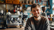© Alina Tymofieieva - Portrait of a young barista in a cafe behind the bar counter. Happy man working in a cafe. Coffee making concept, small business.