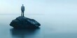 © Anastasiia - Balancing Risk and Safety: Businessman Standing on Rock in Ocean. Concept Business, Risk Management, Safety Measures, Courage, Ocean Adventure
