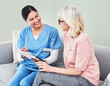© peopleimages.com - Tablet, woman doctor and senior patient in hospital for examination, consulting or medical results. Health, advice and friendly physician with elderly person for good news, diagnosis or support