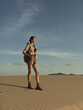 © SHOTPRIME STUDIO - Lonely woman standing in the vast desert landscape, gazing into the unknown horizon
