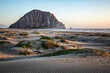 © Danita Delimont - USA, California, Central Coast, Morro Bay. Sunset light across dunes and Morro Rock