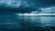 © Justlight - The calm before the storm as a singular water spout forms a warning of the chaos to come.