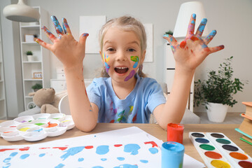 Canvas Print - Happy little girl in paint at home