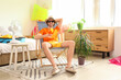 © Pixel-Shot - Male tourist with cocktail sitting in deck chair at home on vacation