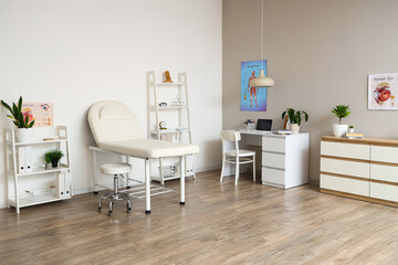 Poster - Interior of medical office with couch, shelf units and doctor's workplace