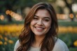 © Asfand - Smiling young woman outdoors. Close up of beautiful woman smiling with happiness while looking at camera in a park