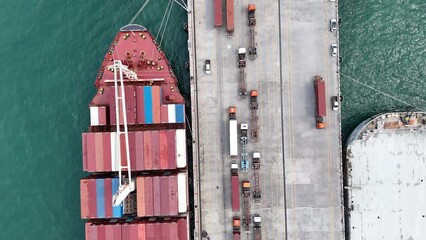 Wall Mural - Cargo Container Ship with truck at commercial dock port. Shipyard Cargo Container Sea Port Freight forwarding service logistics and transportation. International Shipping Customs Port.	
