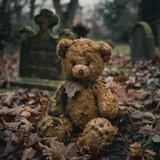 Fototapeta  - A scary teddy bear in a graveyard