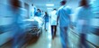 © Pnitha - European doctors and nurses walking in hospital hallway with patient on gurney, motion blur, out of focus