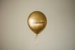 © Lal - A golden balloon floating against a white backdrop, with the word 'Freedom'