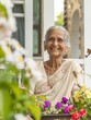 © Ryzhkov - Senior Indian Woman Enjoying Gardening in Her Backyard on International Day of Older Persons, Embracing Active Aging