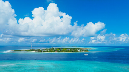 Wall Mural - The aerial view of Small tropical island in the ocean, Maldives.