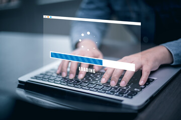 Wall Mural - the man is using a computer under the concept of technology, downloading, uploading, and database ma