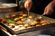 © OhmArt - Israeli falafel being fried to perfection.