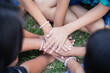 © chaunpis - Closeup of diverse people holding hands