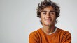 © Claudine - young man wearing orange sweater over isolated white background happy face smiling with crossed arms looking at the camera illustration photo