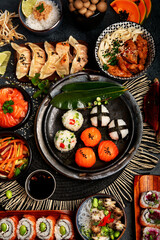 Wall Mural - Traditional Japanese food dishes served on the table.