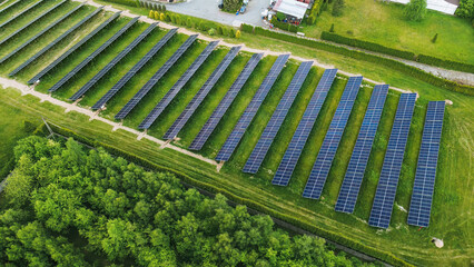 Wall Mural - Drone view of solar farm at sunset Solar panels producing power