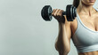 © Chananphat - A woman lifting dumbbells on white  background, healthy concept