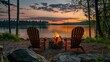 © JS_Stock - Serene sunset lake view with adirondack chairs around a fire pit by the water's edge, surrounded by trees