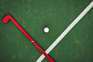 Wall Mural - Field hockey stick and balls on green grass. Horizontal sport theme poster, greeting cards, headers, website and app