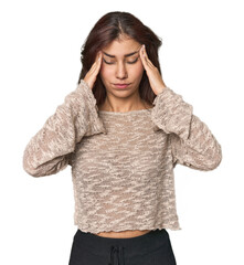 Wall Mural - Middle Eastern woman in studio touching temples and having headache.