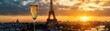 © GoodRNG - A classic French champagne flute with bubbles rising, set against a backdrop of the Eiffel Tower at sunset