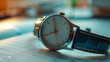 © SashaMagic - Classic wristwatch with leather strap on a desk planner.