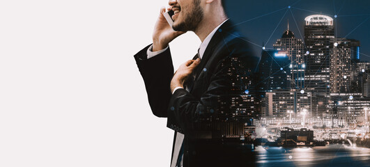 Wall Mural - Double Exposure Image of Business Communication Network Technology Concept - Business people using smartphone or mobile phone device on modern cityscape background. uds