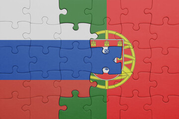 puzzle with the colourful national flag of portugal and flag of russia.