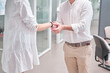 © Oscar - Men and women shake hands after office visit. psychiatrist greets patient by shaking hands