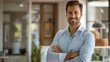 © Yun - Confident Business Success: Cheerful Businessman in a Contemporary Office