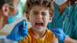 © Inna - In  hospital office, boy is afraid to get vaccine in his shoulder and cries. The child screams, is afraid of the syringe and does not want to give an injection. Children's fear of medical proce