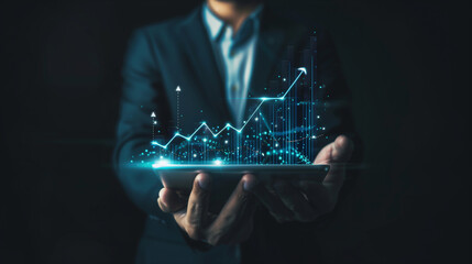 Canvas Print - arafed image of a man in a suit holding a tablet with a graph on it