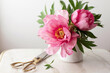 © Kelly Knox/Stocksy - pink peonies in a vase