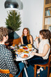 © Studio Firma/Stocksy - X-mas lunch with friends