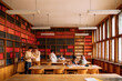 © Studio Firma/Stocksy - Students in library