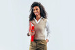 © VICTOR TORRES/Stocksy - Confident black businesswoman with a red folder in office setting