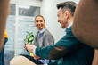 © VICTOR TORRES/Stocksy - Office colleagues interacting with positive dynamics