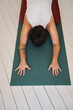 © Nicola Suttle/Stocksy - Woman doing yoga in Extended Child pose