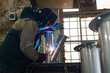 © Olena Smyrnova/Stocksy - Male welder is welding stainless pipe in industrial workshop