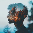 © ArthurGraphix - Artistic double exposure of a young man's silhouette blended with a forest landscape, creating a surreal and dreamlike visual effect.